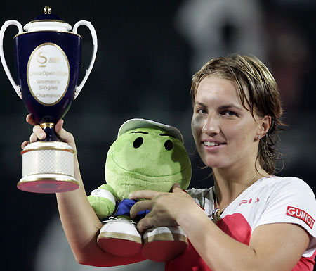 Russia's Svetlana Kuznetsova kisses the trophy after winning against France's Amelie Mauresmo at the China Open final in Beijing September 24, 2006. 