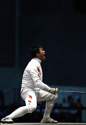 China's Wang Lei reacts after beating Portugal's Joaquim Videira in their men's fencing individual epee final at the World Fencing Championship in Turin October 2, 2006.