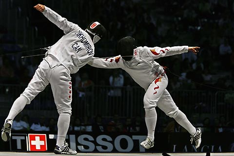 China's Wang Lei competes with Canada's Igor Tikhomirov in their men's fencing individual epee semi-final at the World Fencing Championship in Turin October 2, 2006.