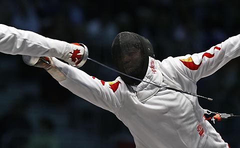 China's Wang Lei competes with Canada's Igor Tikhomirov in their men's fencing individual epee semi-final at the World Fencing Championship in Turin October 2, 2006.