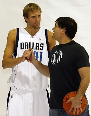 Dallas Mavericks forward Dirk Nowitzki (L) and team owner Mark Cuban shake hands after being photographed at the NBA Dallas Mavericks Media Day in Dallas, Texas October 2, 2006. 