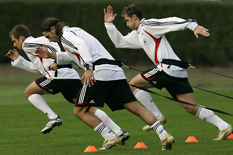 German national soccer team players (L to R) Philipp Lahm, Torsten Frings and Miroslav Klose warm up during a team practice session in the town of Kuehlungsborn October 9, 2006. Germany faces Slovakia in a Euro 2008 Group D qualifying soccer match on Wednesday in Bratislava.