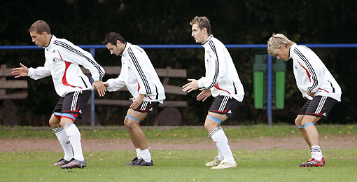 German national soccer team players (L to R) Philipp Lahm, Torsten Frings and Miroslav Klose warm up during a team practice session in the town of Kuehlungsborn October 9, 2006. Germany faces Slovakia in a Euro 2008 Group D qualifying soccer match on Wednesday in Bratislava.