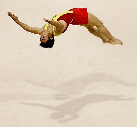 China's Liang Fullang competes in the floor exercise during the men's team finals at the Artistic Gymnastics World Championships in Aarhus, Denmark October 17, 2006. China took the gold medal in the event, followed by silver medallist Russia and bronze winner Japan.