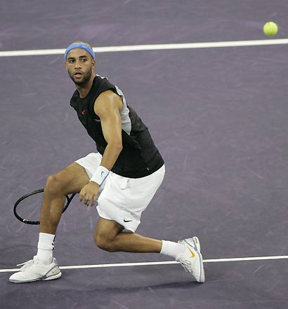 James Blake of the U.S hits a return to Roger Federer of Switzerland during the final of the Masters Cup tennis tournament in Shanghai, China November 19, 2006. 
