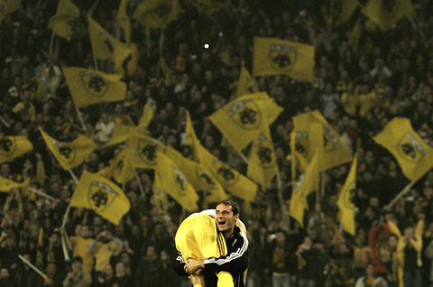AEK Athens players celebrate after beating AC Milan in their Champions League Group H soccer match at the Olympic stadium in Athens November 21, 2006.