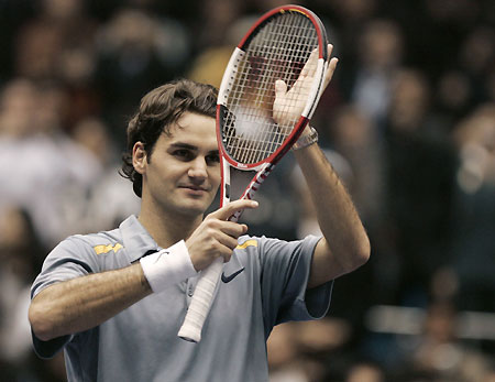 Switzerland's Roger Federer celebrates after defeating Spain's Rafael Nadal during an exhibition tennis match in Seoul November 21, 2006. 