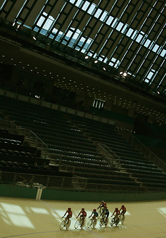 Hong Kong's cycling team practice on the track for the upcoming Asian Games in Doha November 28, 2006. 