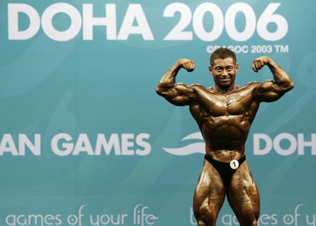 Japan's Yoshihiro Yano competes in the men's under-75kg bodybuilding event at the Asian Games in Doha December 8, 2006. 