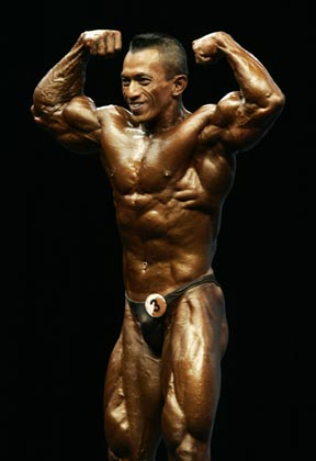 Malaysia's Sazali Abd Samad competes in the men's minus 65 kilograms bodybuilding event at the Asian Games in Doha December 8, 2006. Abd Samad won the silver medal. 