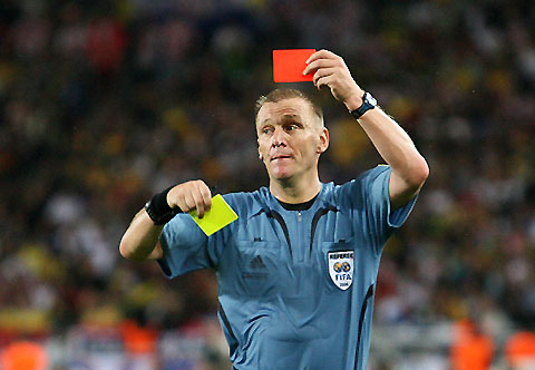 PICTURES OF THE YEAR 2006 Referee Graham Poll of England shows a red card to Australias Brett Emerton during the Group F World Cup 2006 soccer match between Croatia and Australia in Stuttgart June 22, 2006. 
