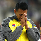 Sittichai Suwonprateep of Thailand perform the wai, a traditional Thai greeting, during the award ceremony for the men's 4x100m relay race final at the 15th Asian Games in Doha December 12, 2006. 
