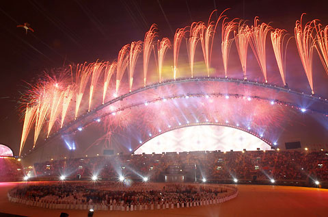 Fireworks explode over the Khalifa Stadium during the closing ceremony of the 15th Asian Games in Doha December 15, 2006.