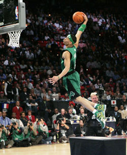 Boston Celtics' Gerald Green leaps over a table en route to a dunk during the NBA All-Star slam dunk contest in Las Vegas February 17, 2007. 