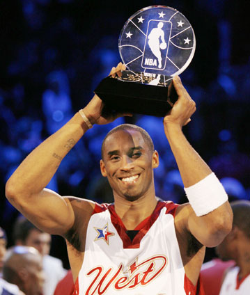 NBA Western Conference All-Star Kobe Bryant holds the NBA All-Star MVP trophy in the air after the 2007 NBA All-Star basketball game in Las Vegas February 18, 2007. 