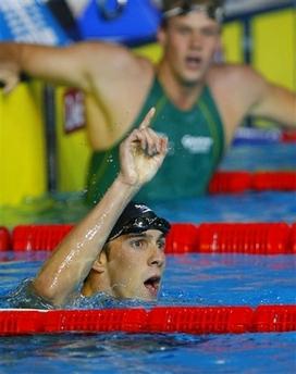 USA's Michael Phelps celebrates after winning the men's 200m Freestyle final with a new world record of 1 minute and 43.86 seconds at the World Swimming Championships in Melbourne, Australia, Tuesday, March 27, 2007.