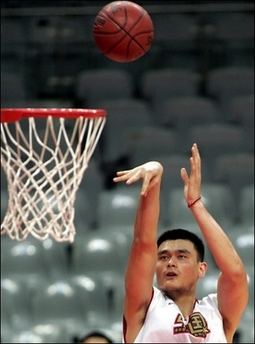 NBA star Yao Ming of the Houston Rockets shoots a basket during a practice session in August 2006. 