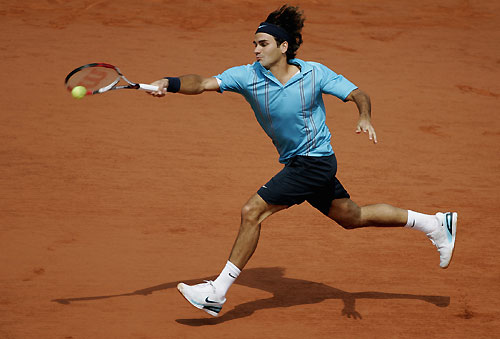 Roger Federer hits a return to Spain's Rafael Nadal during the men's finals of the French Open 
