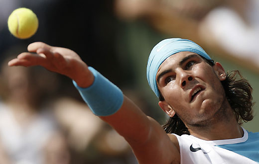 Roger Federer hits a return to Spain's Rafael Nadal during the men's finals of the French Open 
