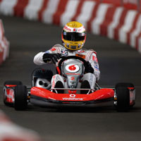 British Formula One racing driver Lewis Hamilton drives his go-kart in central London June 21, 2007. The go-kart was auctioned for ?2,100 on eBay for the baby charity Tommy's. 
