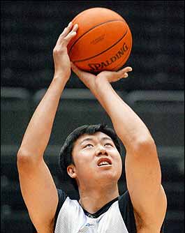 Expelled basketball star Wang makes humble return