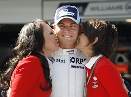 Williams' Formula One driver Nico Rosberg of Germany receives kisses from