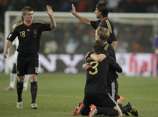 Germany, England through, Ghana survive