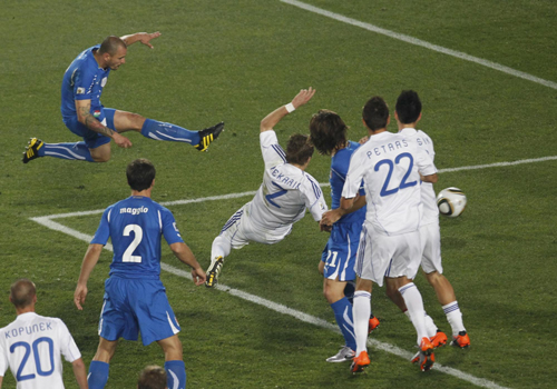 Holders Italy make exit, Japan go through