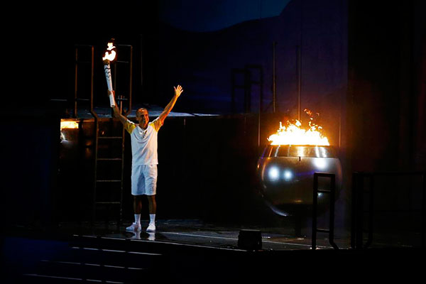 Brazilian marathon runner lights Olympic cauldron