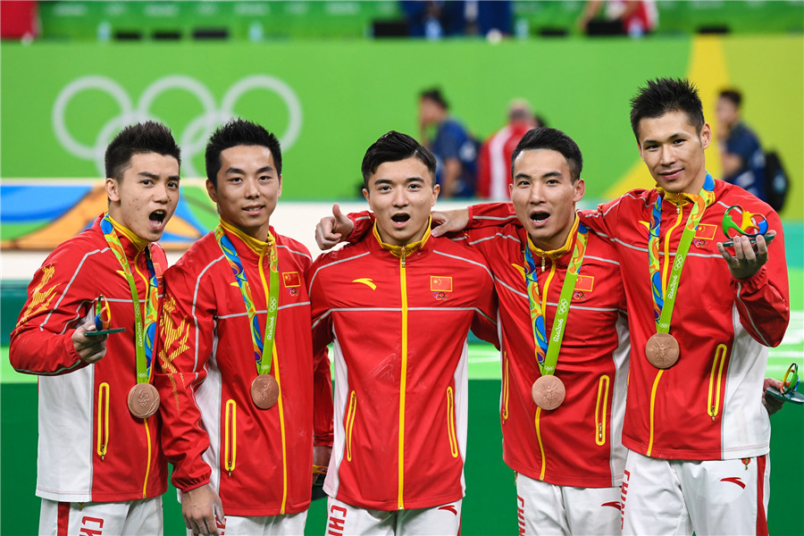 Chinese gymnasts win bronze in men's final, Japan crown