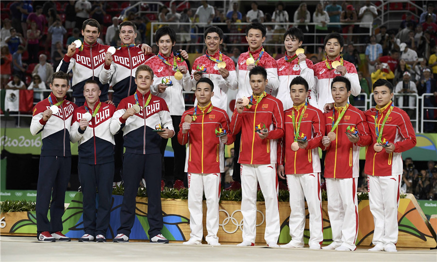 Chinese gymnasts win bronze in men's final, Japan crown