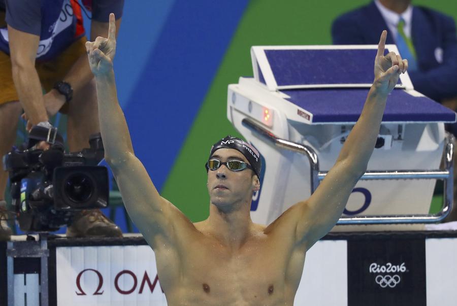 Phelps adds Olympic gold medal haul to historic 21