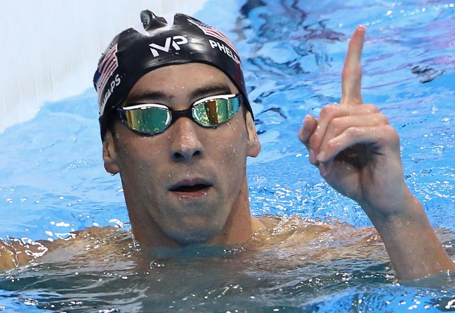 Phelps adds Olympic gold medal haul to historic 21