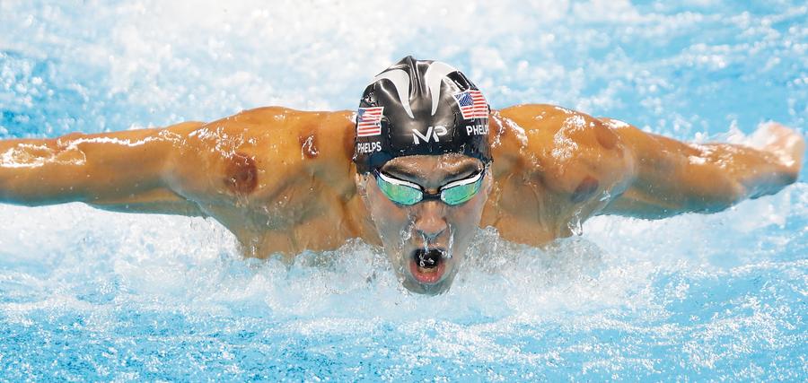 Phelps adds Olympic gold medal haul to historic 21