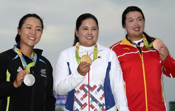China's Feng takes first golf medal for country