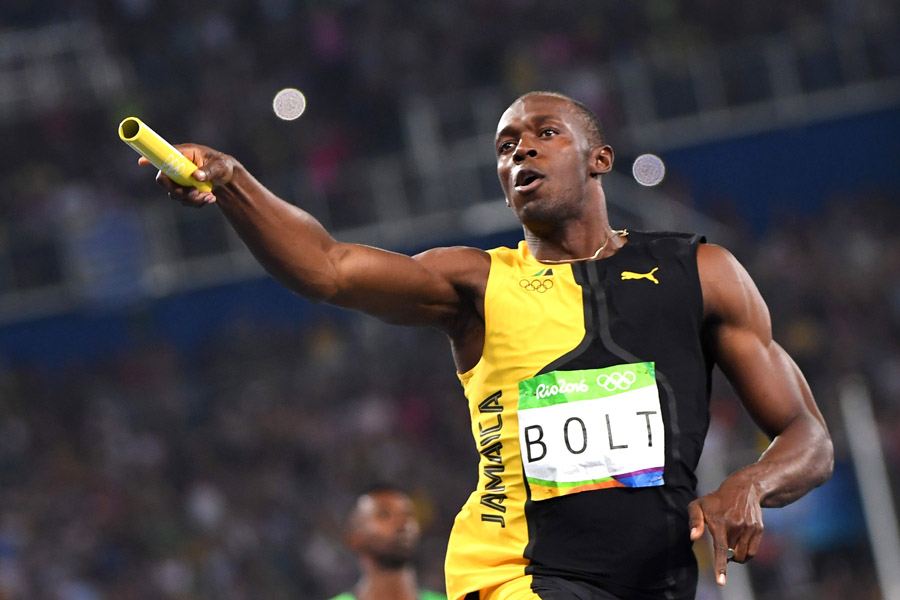 Usain Bolt accomplishes triple hat-trick