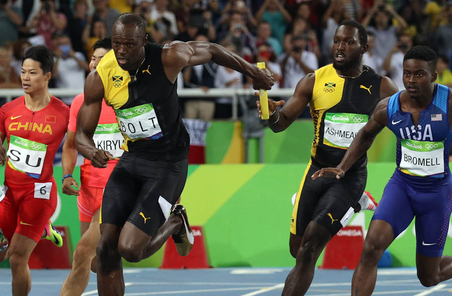 Usain Bolt accomplishes triple hat-trick