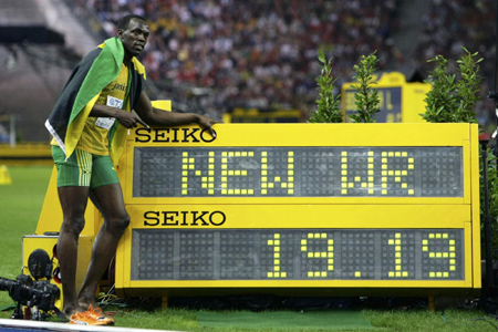 Bolt gets gold, another record in 200 at worlds