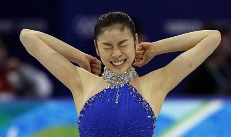 S.Korean Kim wins figure skating gold with record score