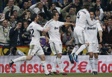 Real top again after comeback win over Atletico
