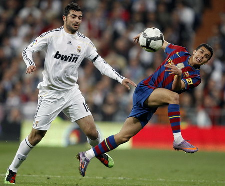 Barcelona beats Madrid 2-0 to lead Spanish league