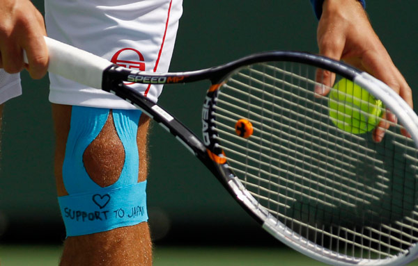 Wozniacki through, Clijsters out injured at Indian Wells