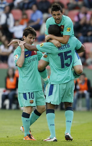 Barcelona draws Levante to claim league title