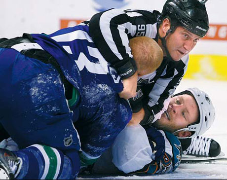 Canucks bust out offense, rout Sharks in Game 2