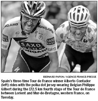 Evans wins to keep yellow jersey bid boiling over