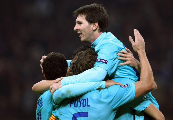 Barcelona secure top spot with win over Milan