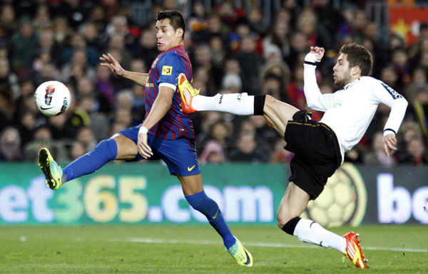 Messi scores four as Barca thrashes Valencia