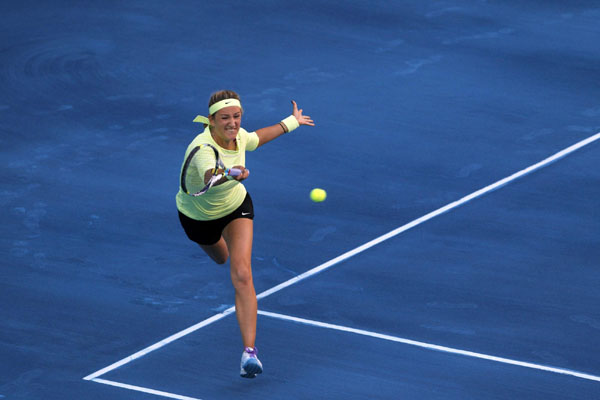 Defending champion Kvitova out, Azarenka through