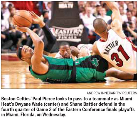 Heat survive to win in OT