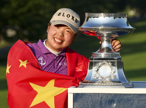 Feng wins first golf major for China